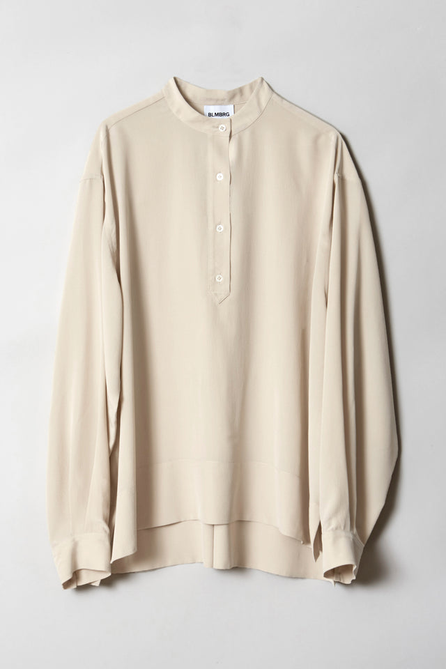 Product image of HELEN oversized silk blouse in cream, featuring a standing collar and mid-length button placket.