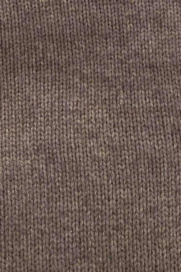 Detail of cashmere sweater knit in mocha photographed flat.